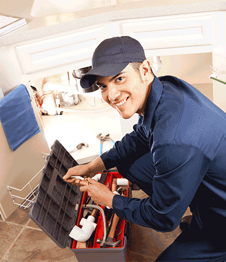 Plumbing services by Gus plumber cleaning a clogged drain