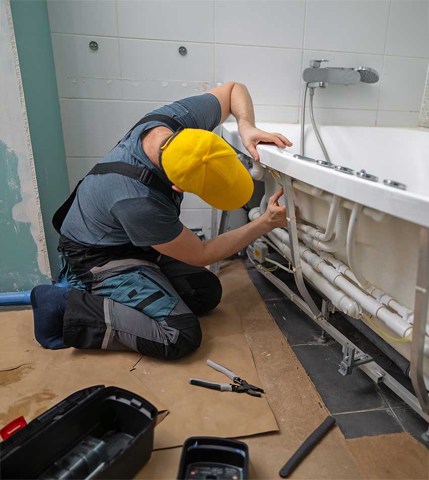 Oldsmar plumber installs a new bath tub.